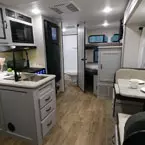 Interior view of kitchen and booth dinette May Show Optional Features. Features and Options Subject to Change Without Notice.