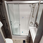 One Piece Residential 48" Shower w/seat, Linen closet, and Porcelain Toilet May Show Optional Features. Features and Options Subject to Change Without Notice.