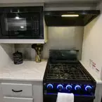 Kitchen range and microwave May Show Optional Features. Features and Options Subject to Change Without Notice.