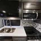 Kitchen and TV May Show Optional Features. Features and Options Subject to Change Without Notice.