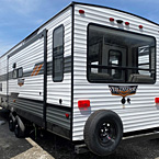 Wildwood 32RET Rear Off-Door Side 3/4 View May Show Optional Features. Features and Options Subject to Change Without Notice.