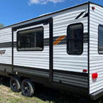 	Wildwood X-Lite 24RLXL Rear 3/4 Off-Door Side View May Show Optional Features. Features and Options Subject to Change Without Notice.