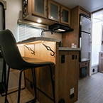 Kitchen with high-top chair and bar May Show Optional Features. Features and Options Subject to Change Without Notice.
