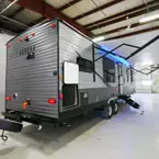 3/4 Rear and Door Side Shown with Solid Steps and Awning Extended. 
 May Show Optional Features. Features and Options Subject to Change Without Notice.