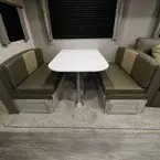 Booth Dinette with Two Cabinet Doors in Benches.
 May Show Optional Features. Features and Options Subject to Change Without Notice.