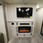 Entertainment Center with 39 Inch TV and 39 Inch Fireplace Built into Four Door Entertainment Center.
 May Show Optional Features. Features and Options Subject to Change Without Notice.