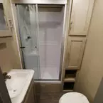 Bathroom- Glass Doors to 36 Inch by 30 Inch Shower, Two Door Linen Closet. Partial of Medicine Cabinet, Vanity and Toilet Shown.
 May Show Optional Features. Features and Options Subject to Change Without Notice.