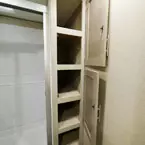 Two Door Linen Closet Shown Open to Show Shelves.
 May Show Optional Features. Features and Options Subject to Change Without Notice.