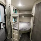 Double Over Double Bunks with a Ladder and Window in Each Bunk.
 May Show Optional Features. Features and Options Subject to Change Without Notice.