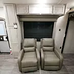 Two Recliner Chairs with Cabinets Overhead and Beside Chairs.
 May Show Optional Features. Features and Options Subject to Change Without Notice.