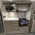 Microwave and Cabinet Mounted Overhead of Stove/Cook Top with Four Drawers and One Cabinet Door.
 May Show Optional Features. Features and Options Subject to Change Without Notice.