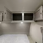 Two Cabinet Doors Overhead of Bed Shown Open.
 May Show Optional Features. Features and Options Subject to Change Without Notice.