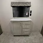 Dresser in Bedroom with One Cabinet Door and Four Drawers.
 May Show Optional Features. Features and Options Subject to Change Without Notice.
