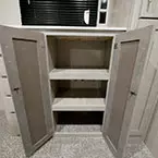Two Wardrobe Closet Doors Shown Open with Shelves.
 May Show Optional Features. Features and Options Subject to Change Without Notice.