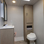 Bathroom toilet and vanity May Show Optional Features. Features and Options Subject to Change Without Notice.