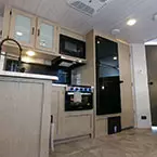 Kitchen, Door to Bathroom and Bunk Beds May Show Optional Features. Features and Options Subject to Change Without Notice.