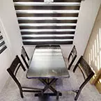Table with Two Fixed and Two Folding Chairs May Show Optional Features. Features and Options Subject to Change Without Notice.