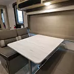 Dinette with view of entrance and murphy bed May Show Optional Features. Features and Options Subject to Change Without Notice.