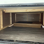 Inside view of underbed storage space from exterior access door
 May Show Optional Features. Features and Options Subject to Change Without Notice.
