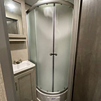 Shower with glass door and skylight
 May Show Optional Features. Features and Options Subject to Change Without Notice.