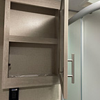 Mirrored medicine cabinet shown open
 May Show Optional Features. Features and Options Subject to Change Without Notice.