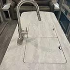 Closer view of island sink with counter covers on, residential faucet with pull down sprayer May Show Optional Features. Features and Options Subject to Change Without Notice.