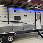 Door-side view with '15 awning Shown closed with LED lighting
 May Show Optional Features. Features and Options Subject to Change Without Notice.