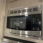Overhead microwave with glass turn table and stove vent fan
 May Show Optional Features. Features and Options Subject to Change Without Notice.