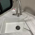Sink with under-mounted farm style basin and faucet with pull-down sprayer
 May Show Optional Features. Features and Options Subject to Change Without Notice.