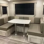 U-shaped dinette with under bench storage and pedestal thermofoil table
 May Show Optional Features. Features and Options Subject to Change Without Notice.
