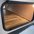 Pass thru storage with panel doors on both sides shown open
 May Show Optional Features. Features and Options Subject to Change Without Notice.