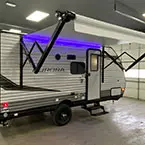 Rear door-side view of unit with awning shown extended and RGB LED light strip shown on May Show Optional Features. Features and Options Subject to Change Without Notice.