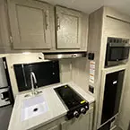 Overhead storage cabinets with overhead microwave oven over refrigerator May Show Optional Features. Features and Options Subject to Change Without Notice.