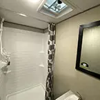 Bathroom shower with curtain, ceiling vent with fan and mirror over sink May Show Optional Features. Features and Options Subject to Change Without Notice.