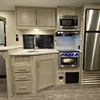 Kitchen area with refrigerator, range, microwave, sink and cabinetry May Show Optional Features. Features and Options Subject to Change Without Notice.