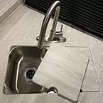 Undermount stainless steel sink with high rise faucet with pull-down sprayer and flush counter cover shown off May Show Optional Features. Features and Options Subject to Change Without Notice.